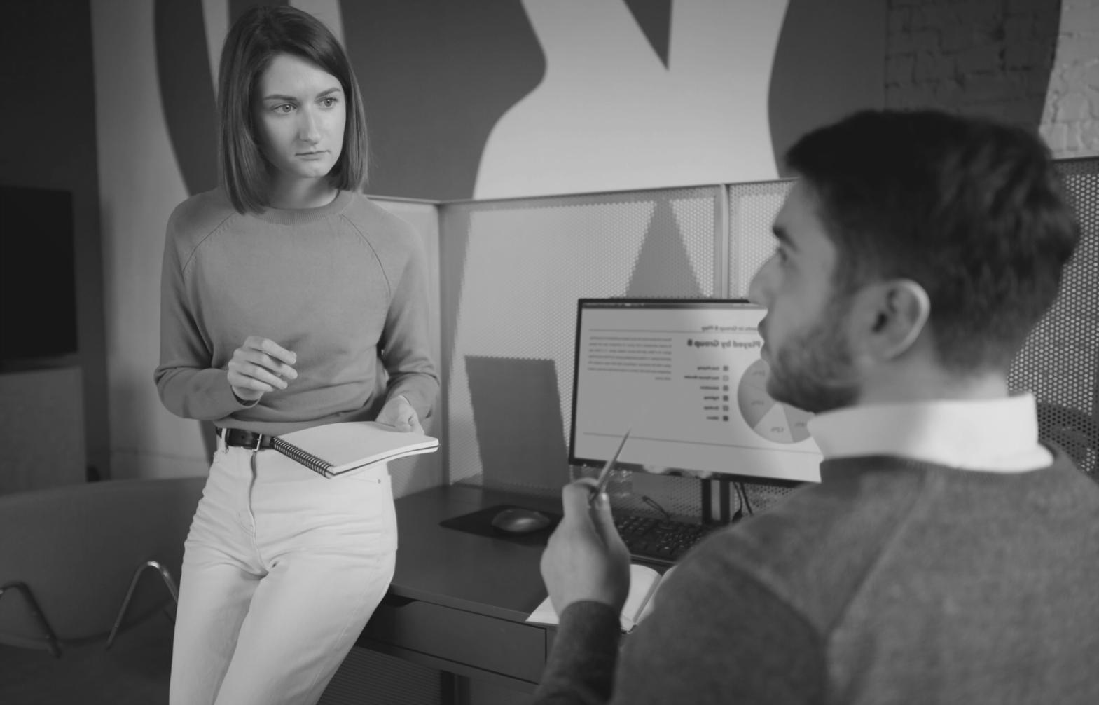 Team collaboration meeting with financial documents and planning materials