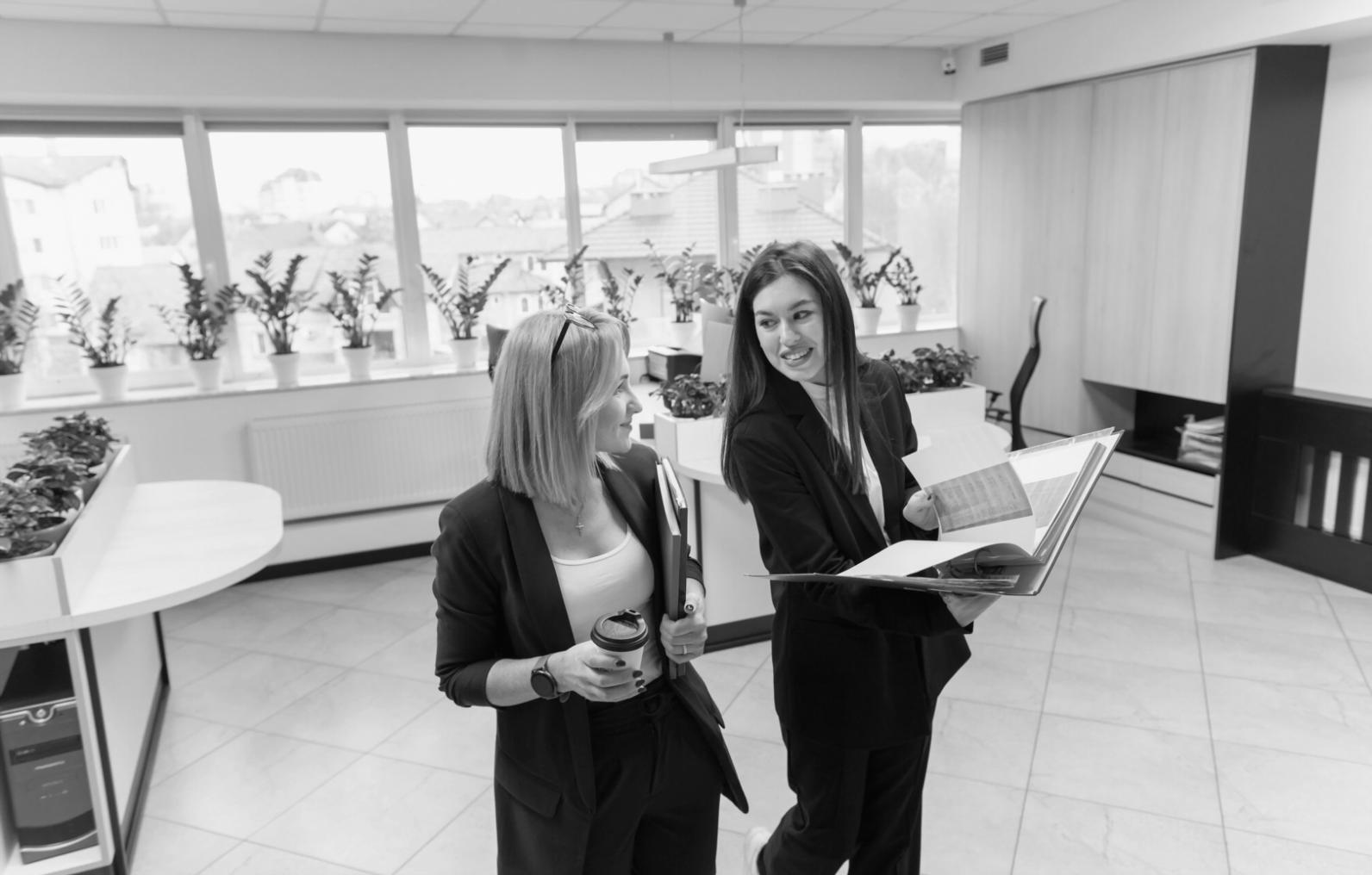 Business owner reviewing budget analysis on laptop with financial charts